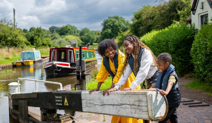 A family taking on a canal boat lock in Worcestershire