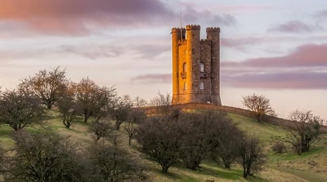 Photo of Broadway Tower during golden hour