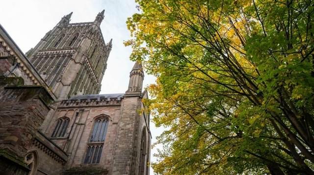 Photo of Worcester Cathedral with autumn trees in foreground
