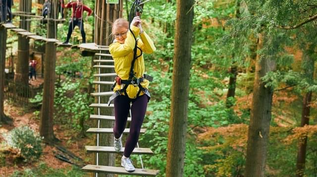 Photo of a young girl taking part in a Go Ape course