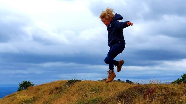 Photo of child jumping on the Malvern Hills
