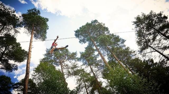 Photo of girl on zip wire at Go Ape Wyre Forest