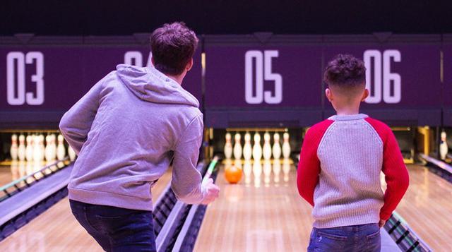 Bowling ball swing male boy