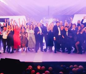 Photos of winners on stage at the Visit Worcestershire Tourism Awards
