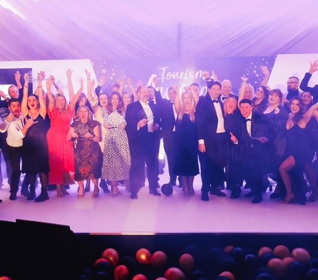Photos of winners on stage at the Visit Worcestershire Tourism Awards